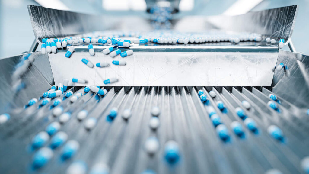 Pills being sorted at a pharmaceutical manufacturing plant. 