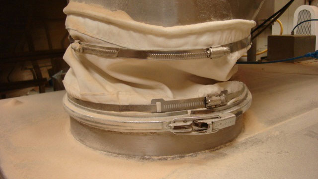 Dust accumulating around a traditional hose clamp. 